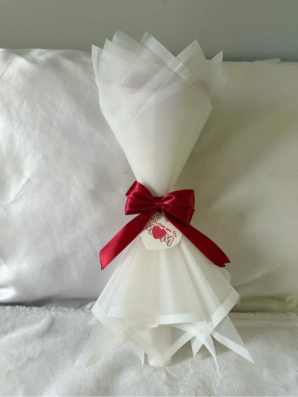 White Translucent Decorative Wrap with Red Satin Bow